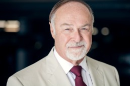Outdoor Natural Light Corporate Staff Headshot on Grey Background by Vancouver Photographer Rob Trendiak